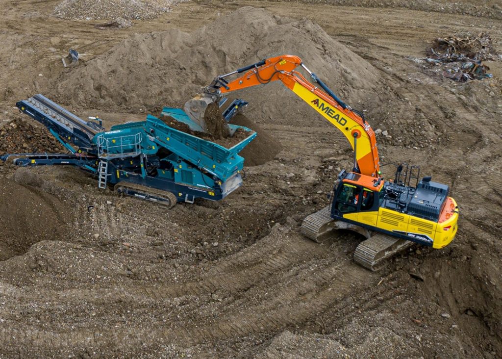 Doosan DX300LC Excavator loading Crusher